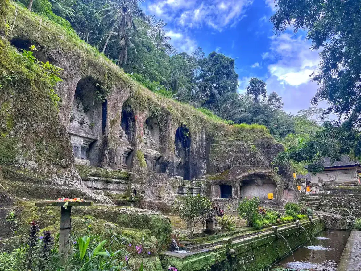 Rock-cut shrines at Gunung Kawi set into a lush river valley
