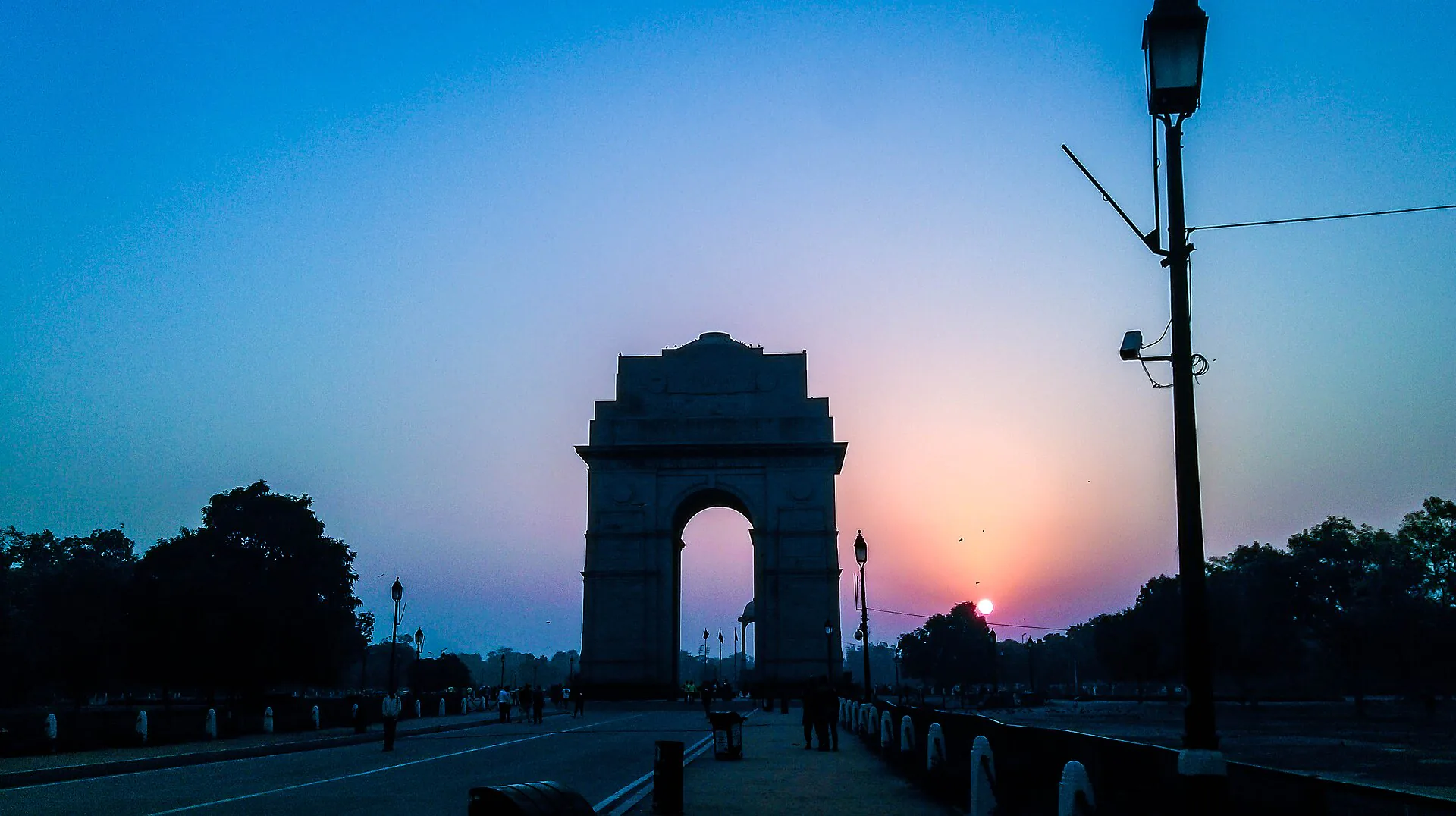 India Gate framed against a colourful Delhi sunset