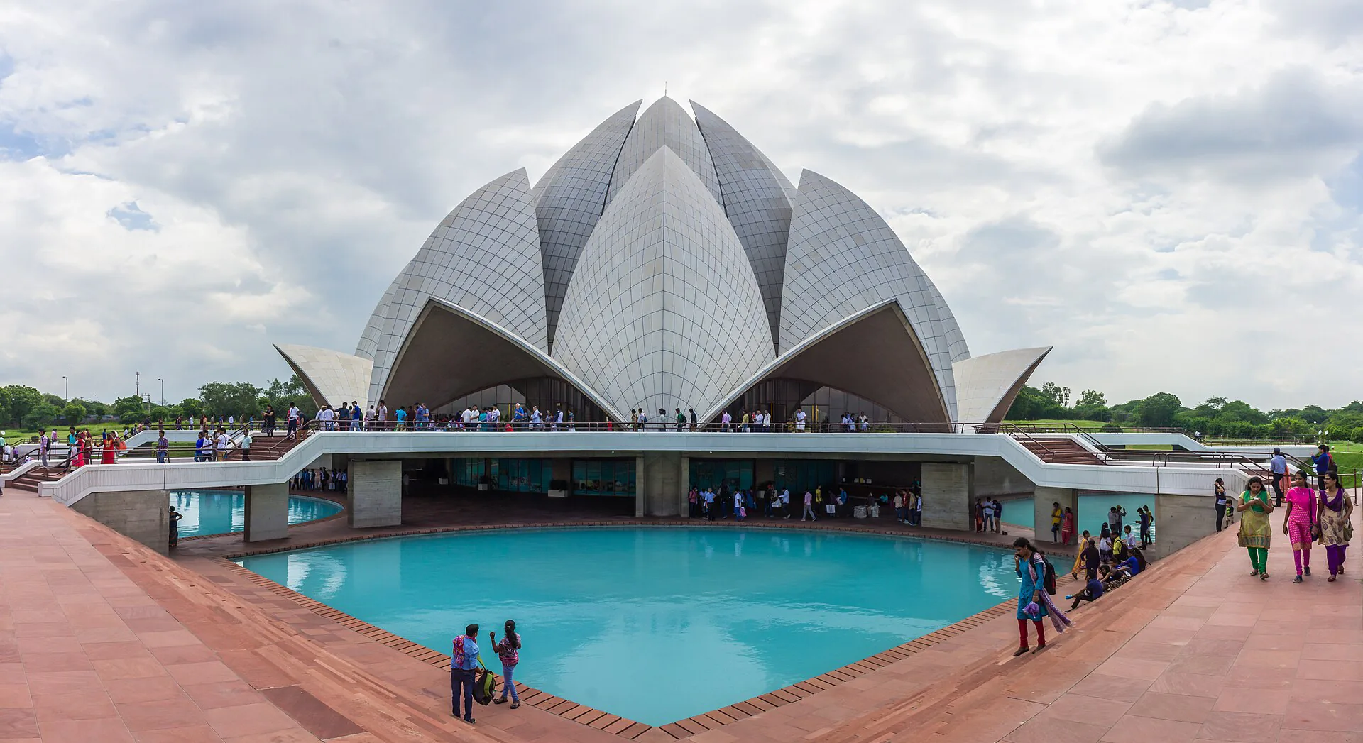 Lotus Temple beneath a cloud-filled Delhi sky