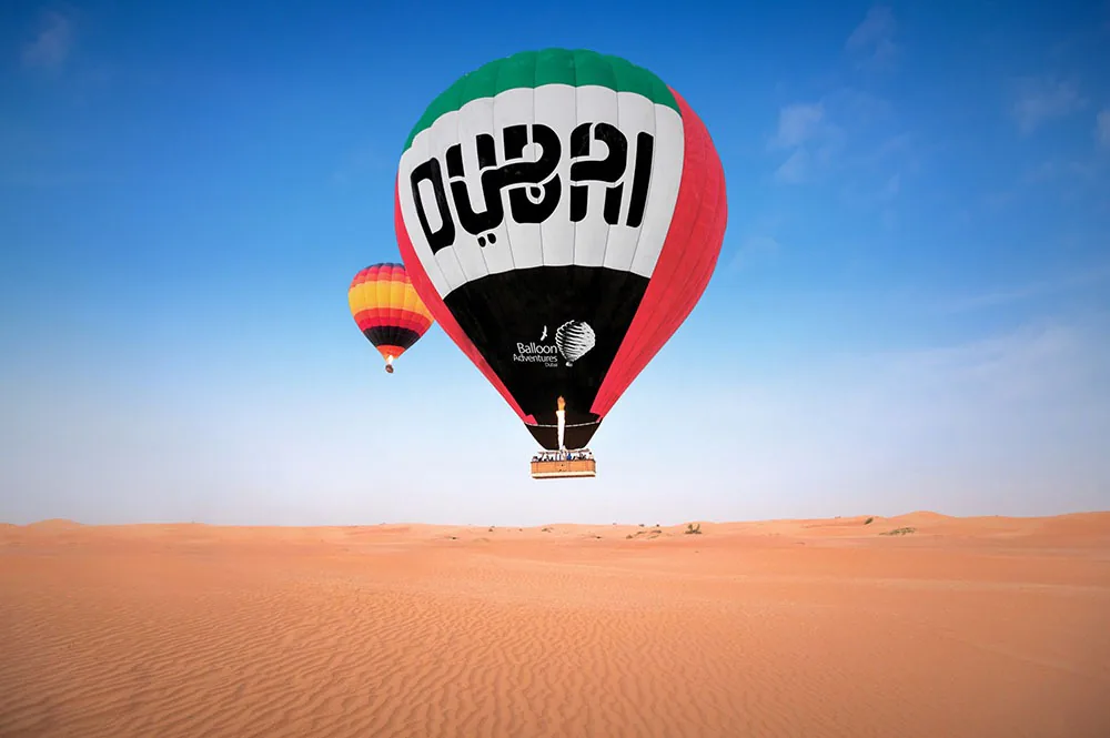 Hot air balloon over the Dubai desert at sunrise
