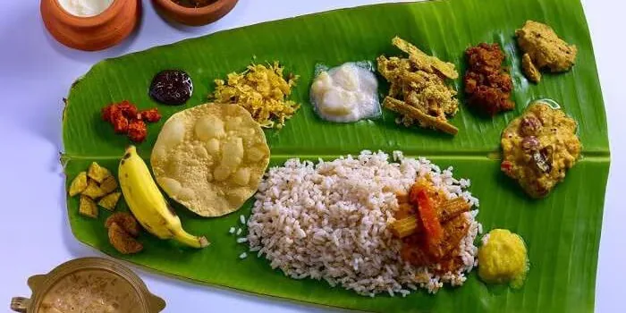 Traditional Kerala lunch served on a banana leaf