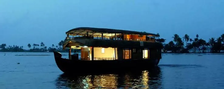 Luxury houseboat on Kerala's backwaters at dusk