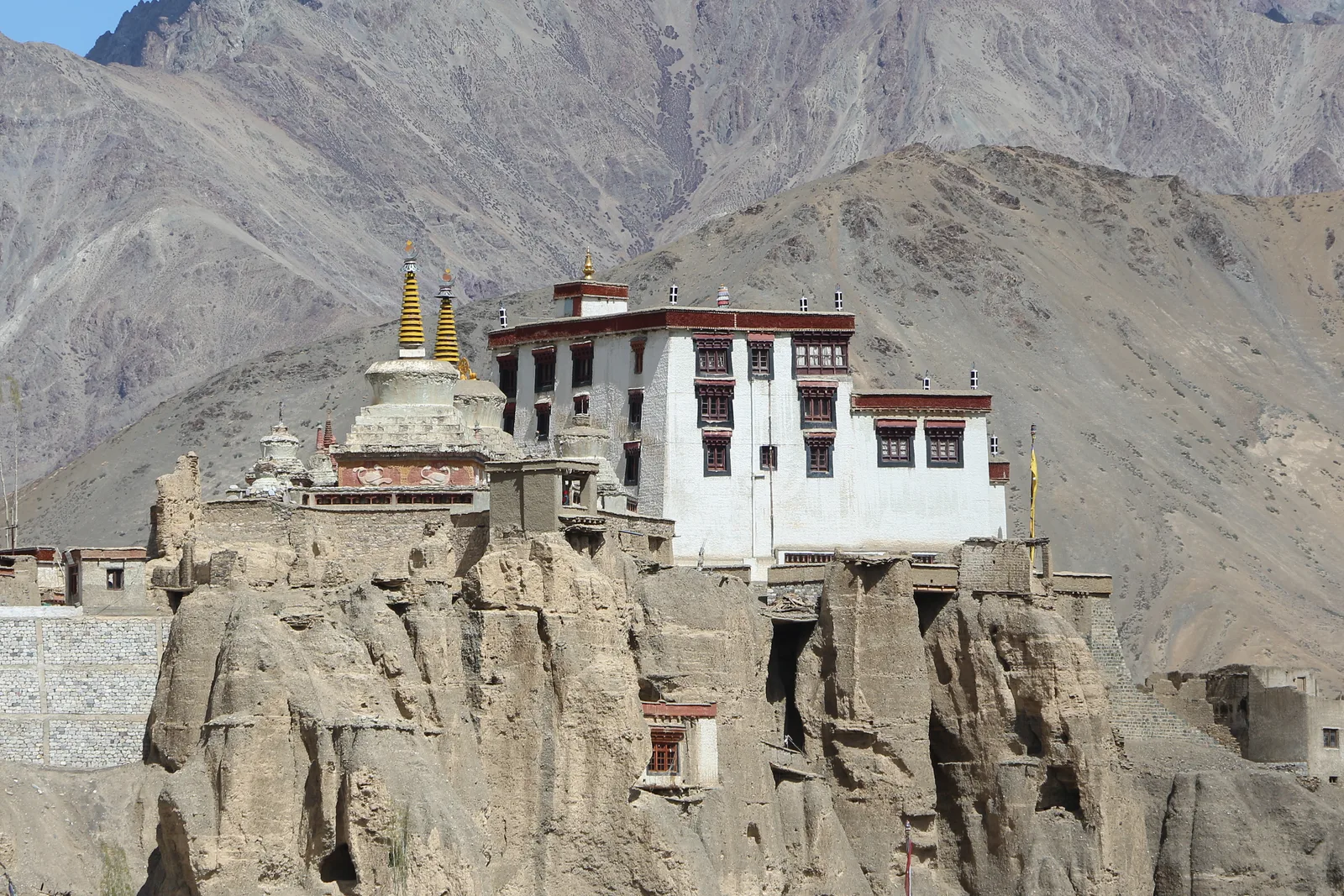 Lamayuru Monastery perched above sculpted moonland cliffs