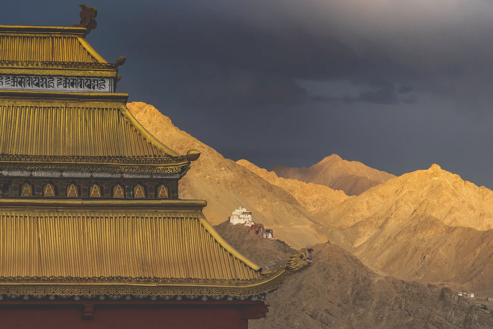 Leh Palace overlooking the town and sunlit Ladakh mountains