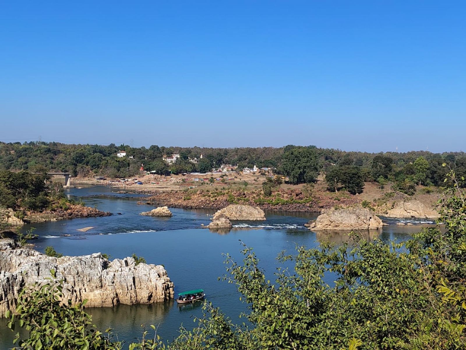 Marble rocks rising above the Narmada at Bhedaghat