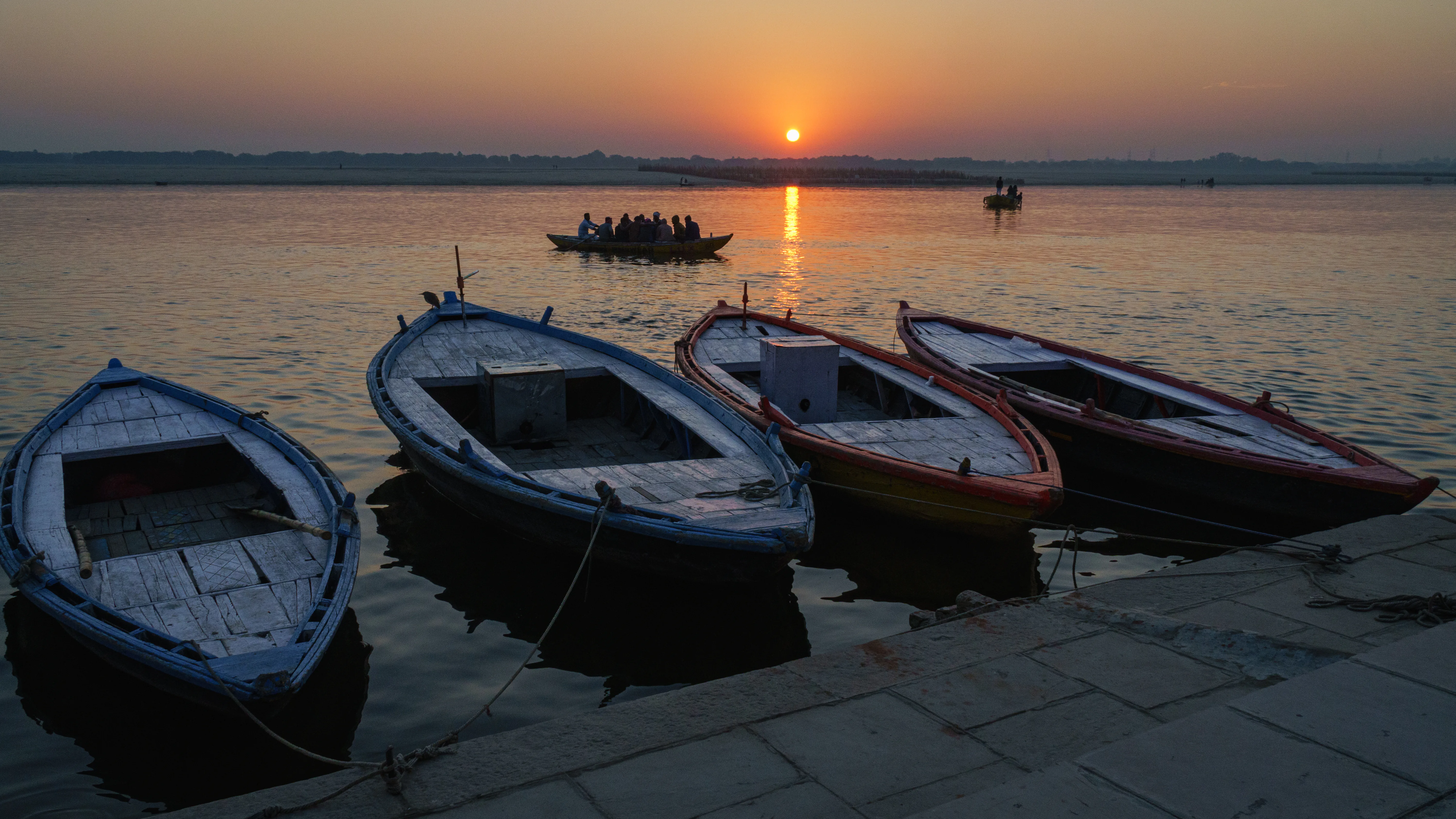 Wooden boats on the Ganges at sunrise in Varanasi