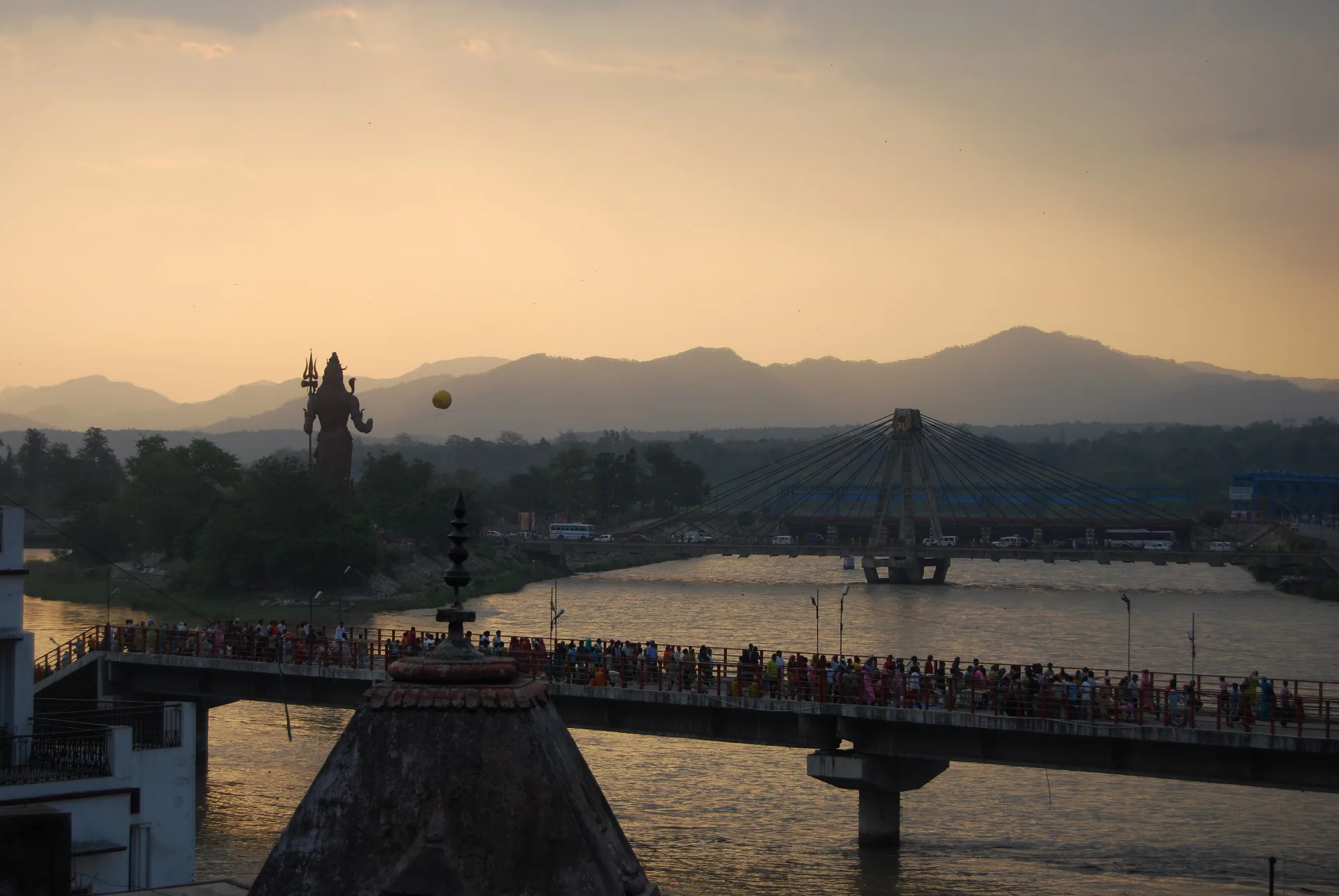 Ganga and a suspension bridge in Rishikesh at sunset